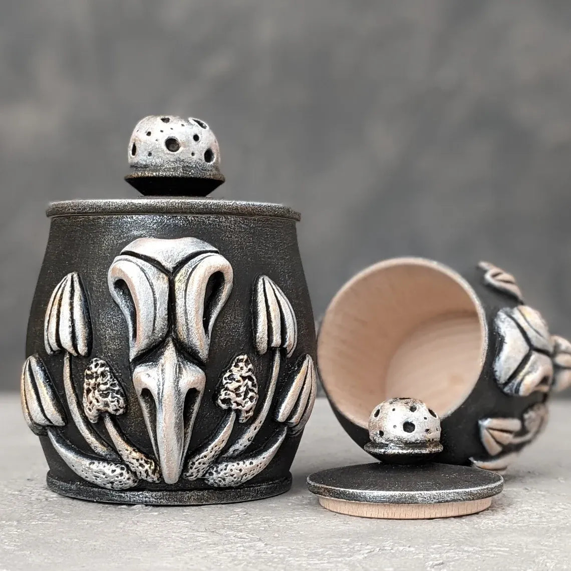 crow skull with mushrooms wooden pot with lid open