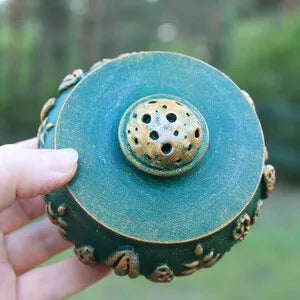 emerald forest meadow wooden pot with lid in hand on nature background