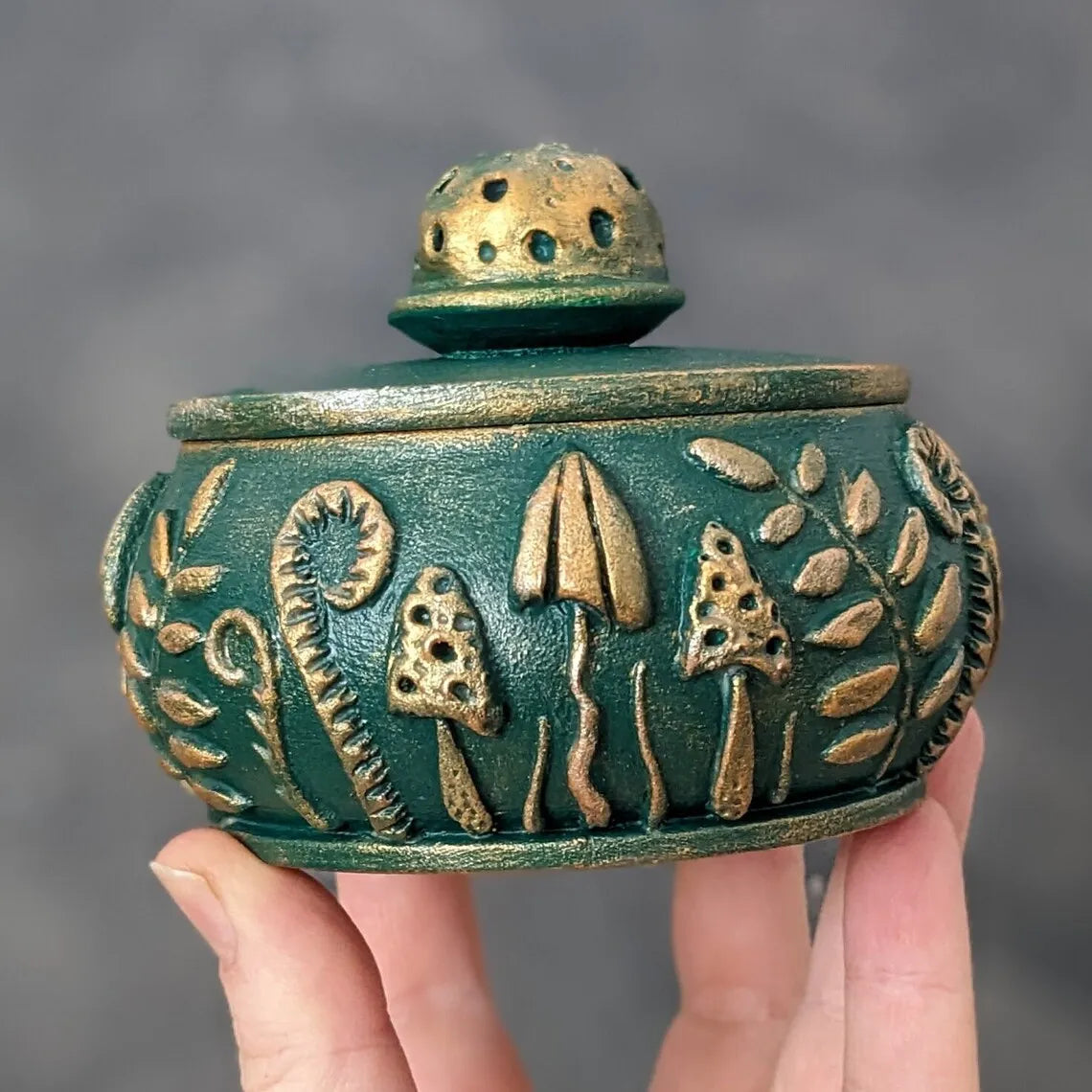 emerald forest meadow wooden pot with lid in hands