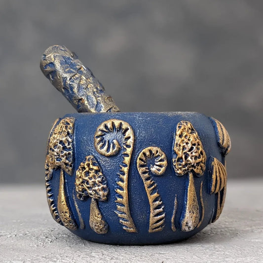 enchanted forest: blue wooden mortar and pestle pestle inside