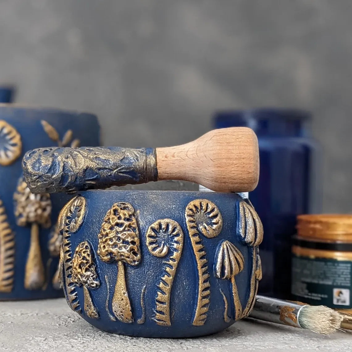 enchanted forest: blue wooden mortar and pestle