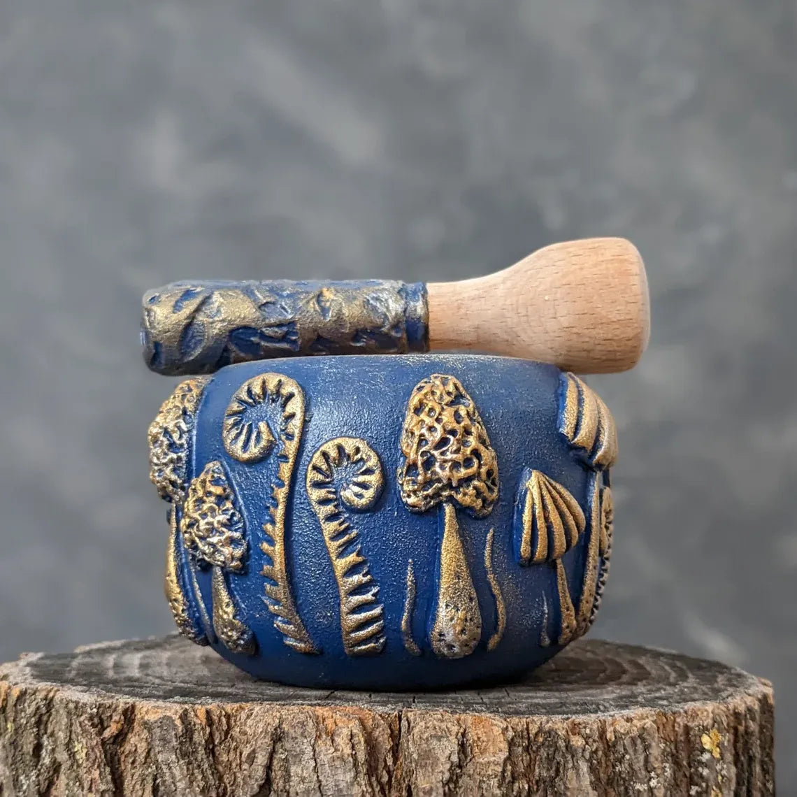 enchanted forest: blue wooden mortar and pestle pestle from above