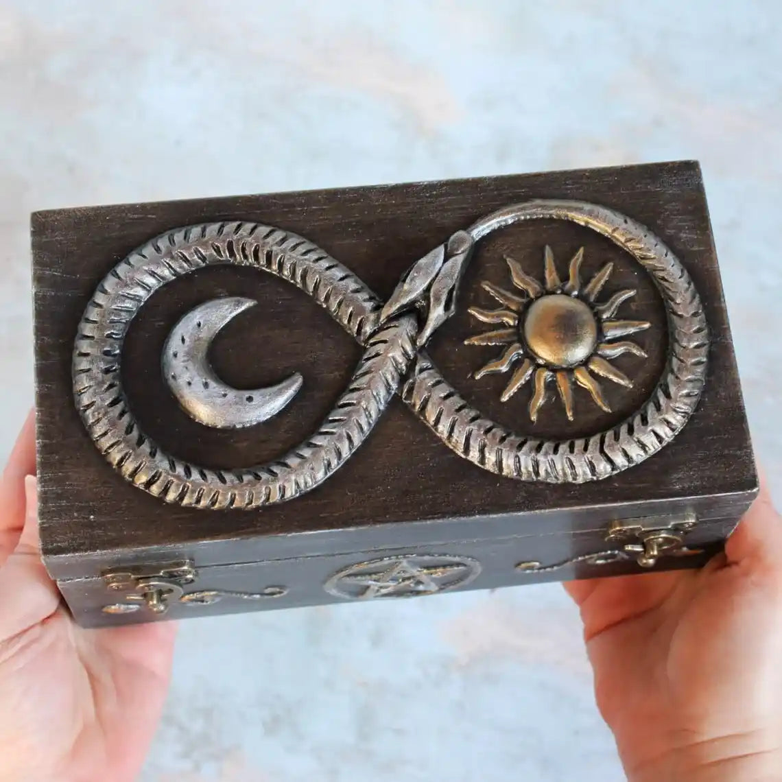 eternal serpent enchanted wooden witches box in hands