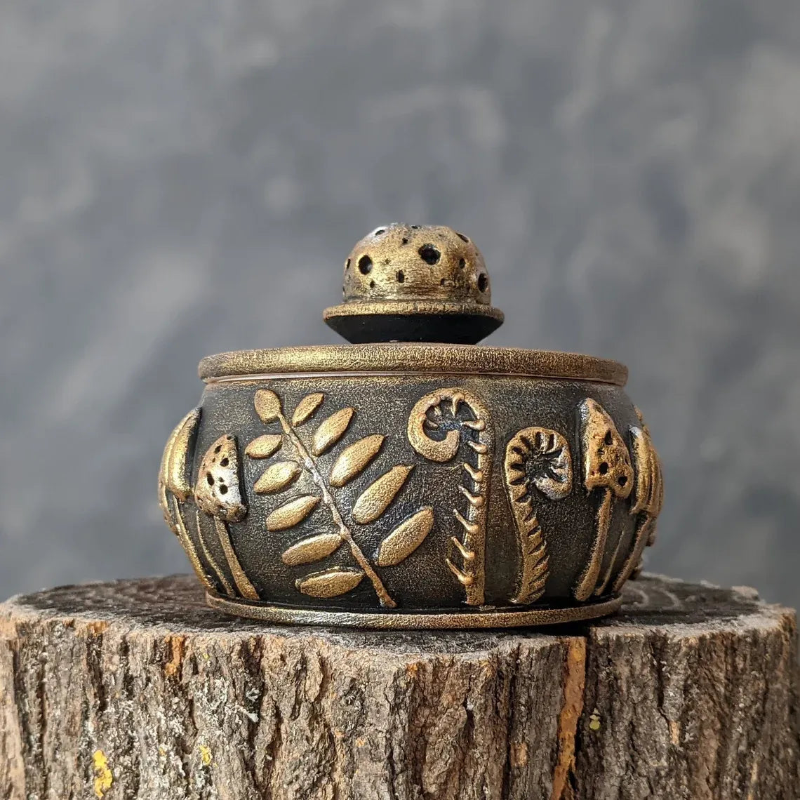 forest glade golden wooden pot with lid on stump