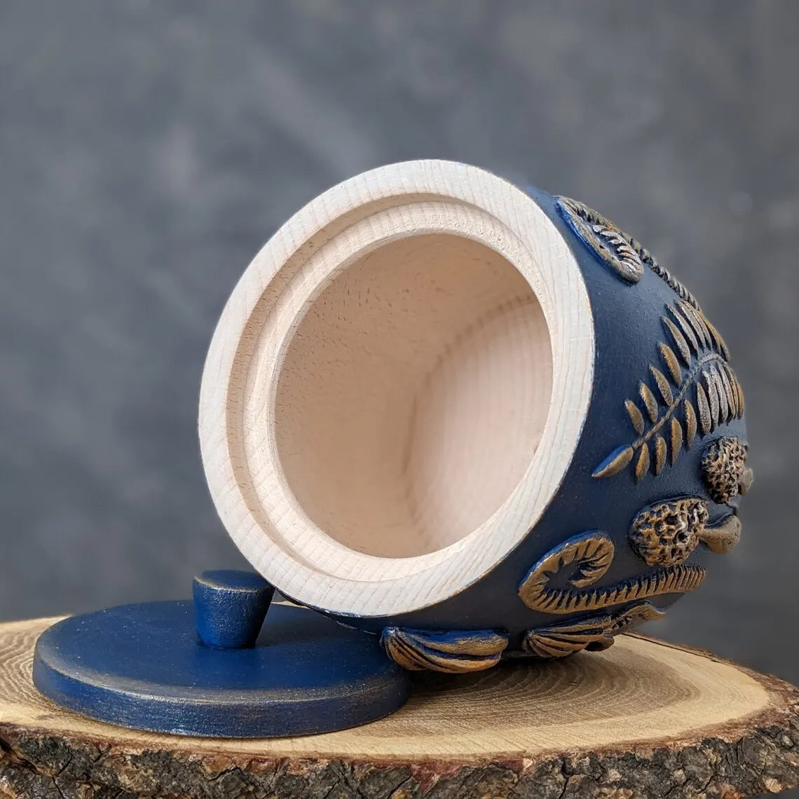 forest herbs and mushrooms blue wooden pot with lid open