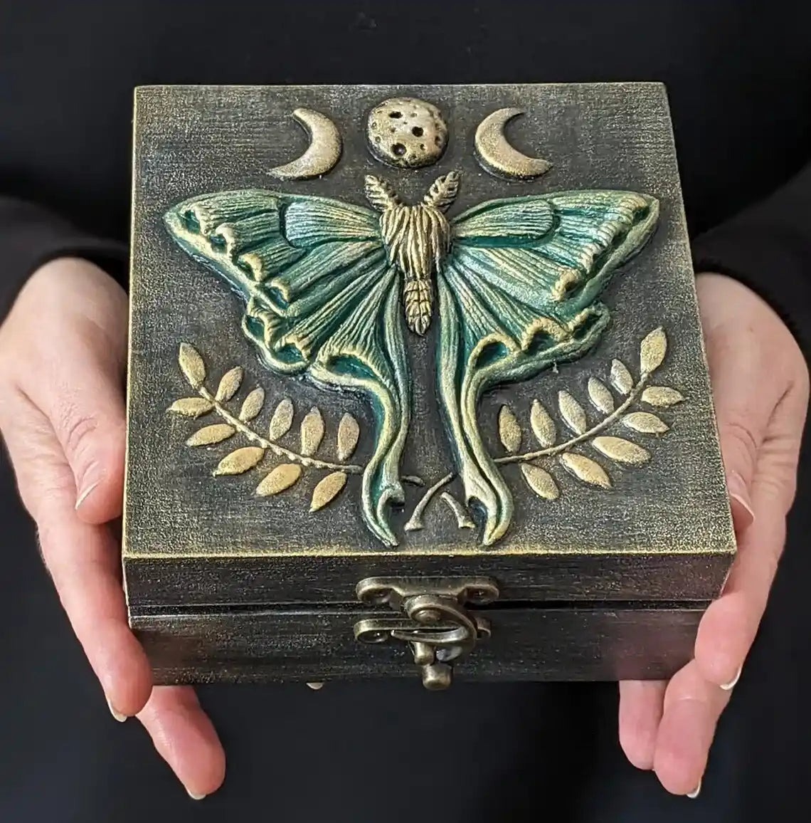 luna moth enchanting wooden witches box in the hands of green color