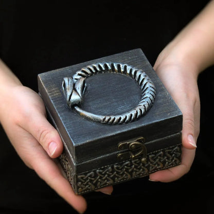 magical eternal wooden ouroboros witch box in hands