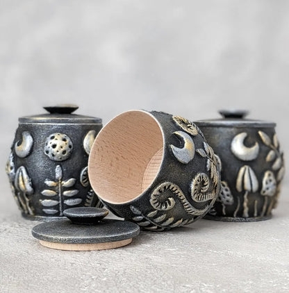 magical herbs and mushrooms under the moon wooden pot with lid silver black outdoor