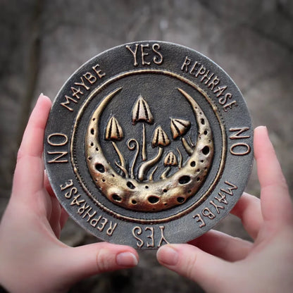 moon and mushrooms pendulum board in hands