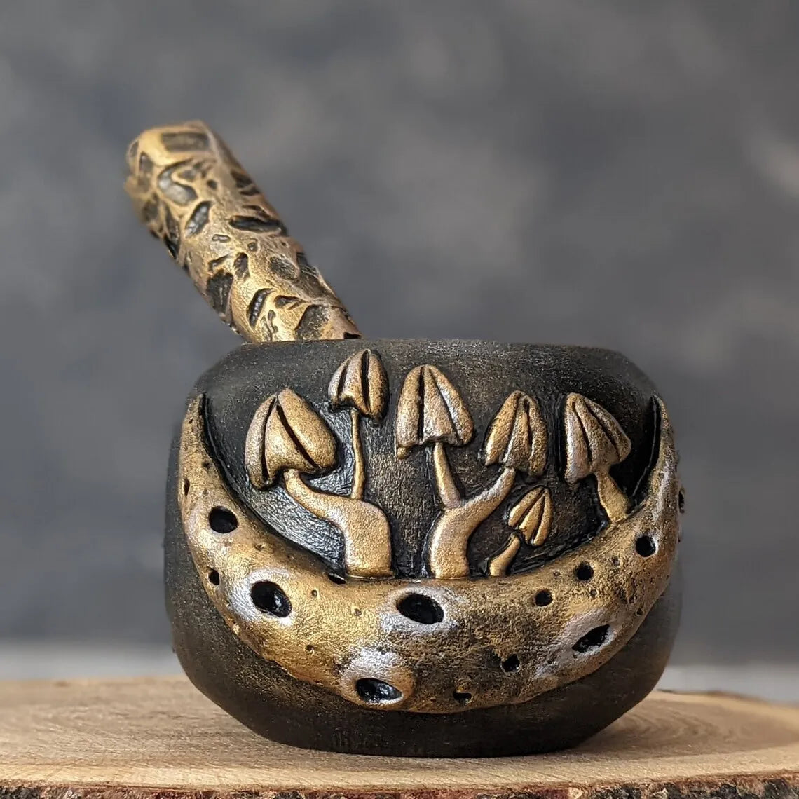 mushroom and moon wooden mortar and pestle in the center of the pestle