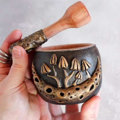 mushroom and moon, wooden mortar and pestle in hands