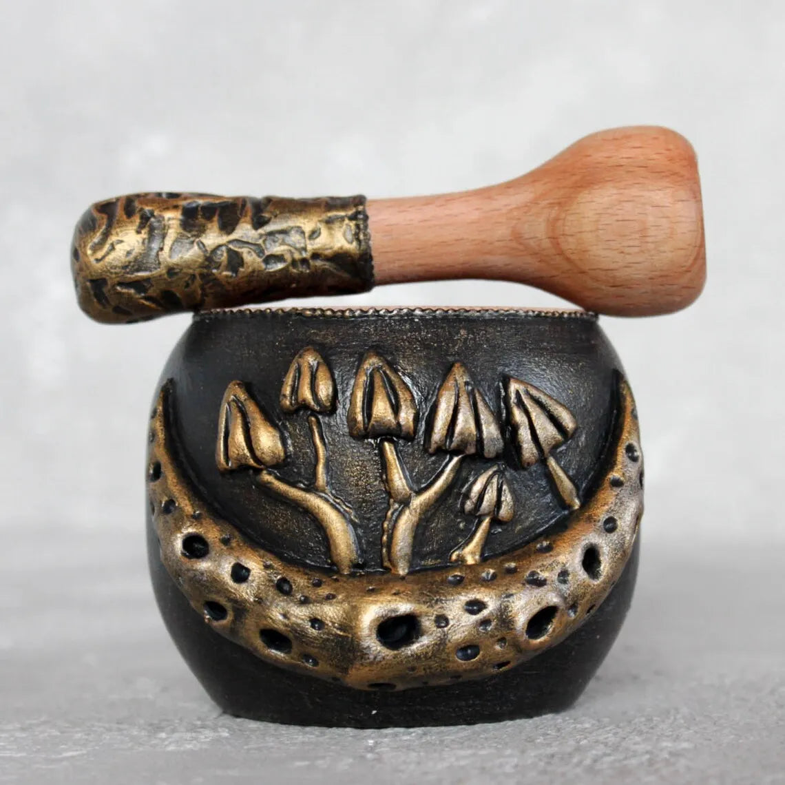 mushroom and moon, wooden mortar and pestle on a light background