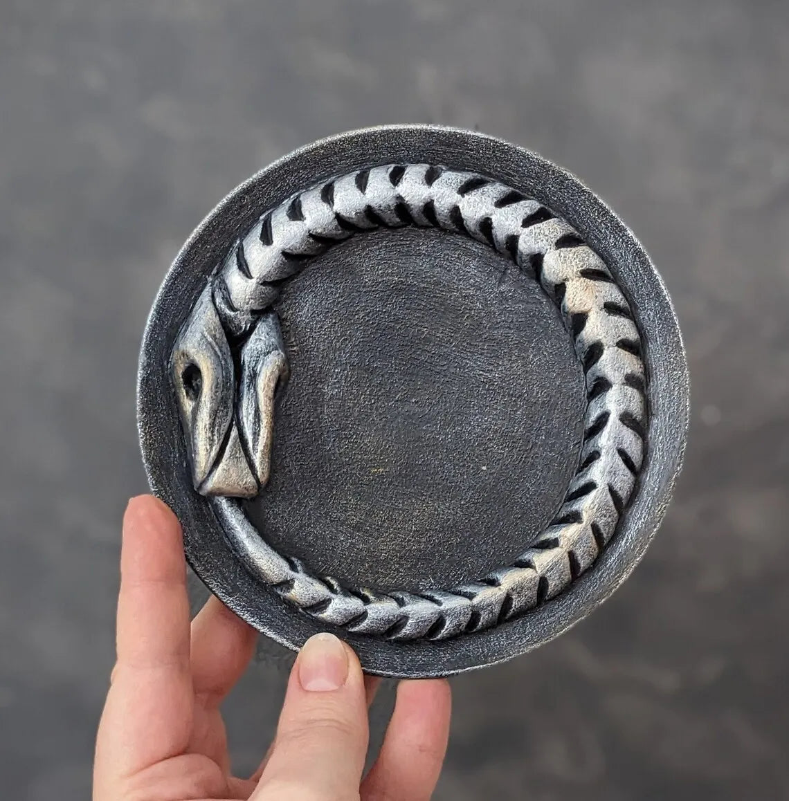 ouroboros offering bowl silver black in hands