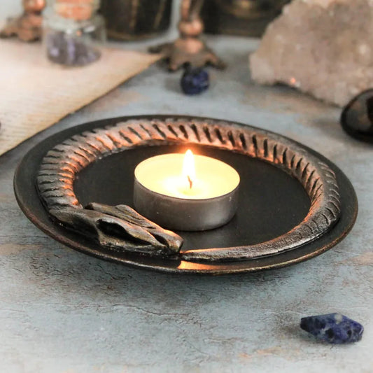 ouroboros offering bowl golden black with candle