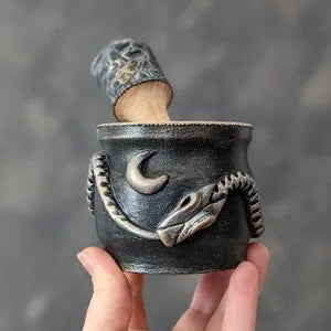 ouroboros wooden mortar and pestle silver black in hand