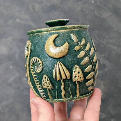 witch glade emerald green pot with lid in hand